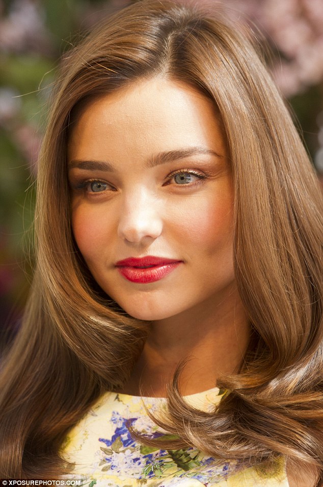 Miranda Kerr looks “bloomin good” in floral dress