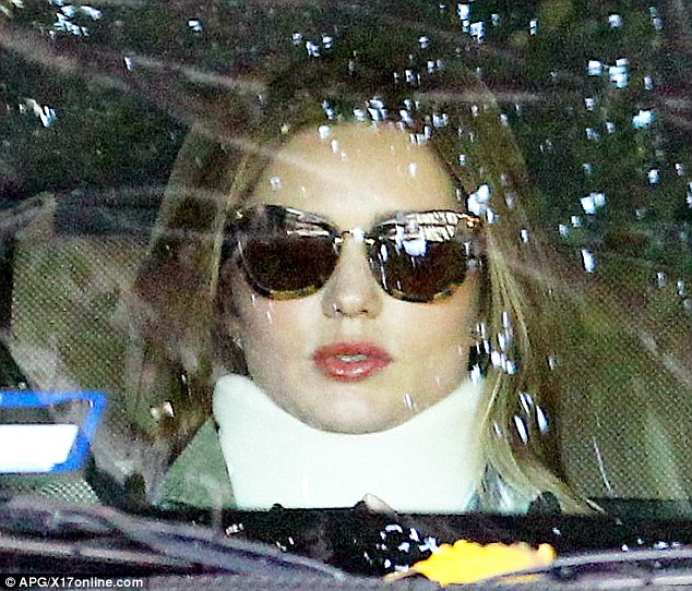 Miranda Kerr goes brace-free as she returns to work